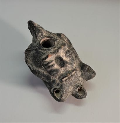 Black terracotta oil lamp with 3 spouts....