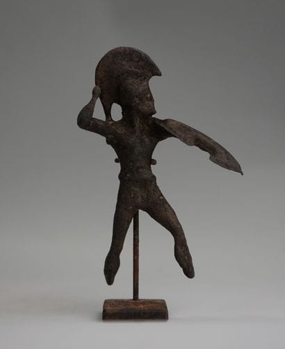 Oplite in bronze with green patina. Greek...