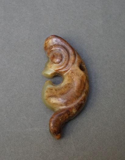 Small coiled dragon in green nephrite, veined...