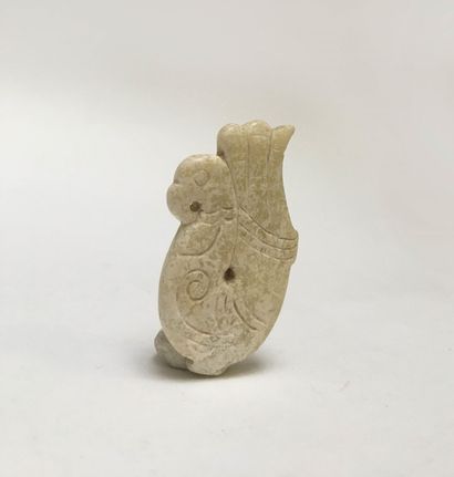 A fish-brain jade pendant representing a...