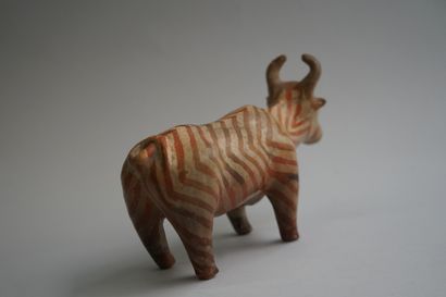 Orange and beige terracotta ox with herringbone...