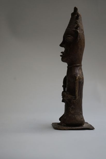 Anthropomorphic statuette of a sorcerer holding...