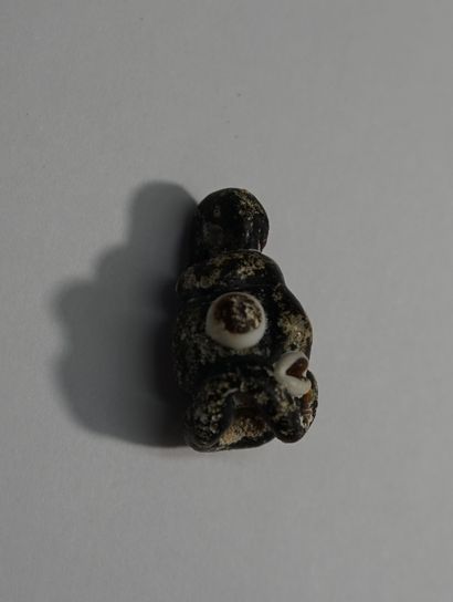 Small Phoenician style head in polychrome...