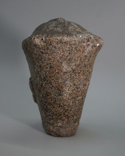 Stone head representing a pharaoh.

Ancient...
