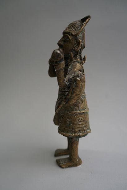Figure presenting a flute player. Bronze...