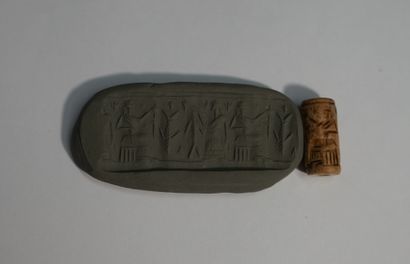 Brown stone cylinder seal showing an offering...