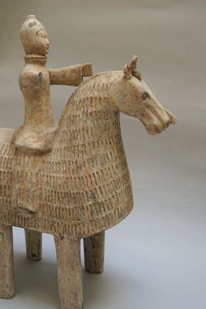 Warrior on a caparisoned horse. Beige and...