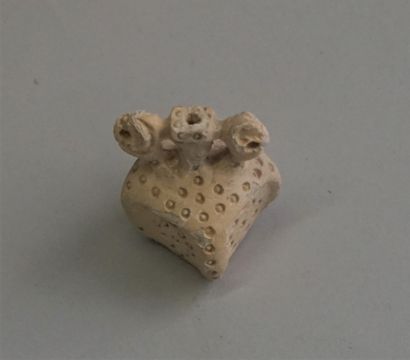 Square idol in soft stone with white slip....