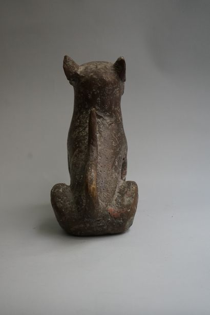Statuette presenting a seated leopard showing...