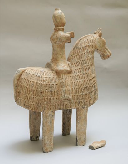 Warrior on a caparisoned horse. Beige and...