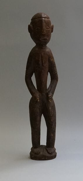 Anthropomorphic statuette showing a standing...