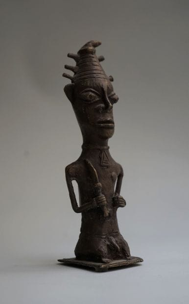 Anthropomorphic statuette of a sorcerer holding...