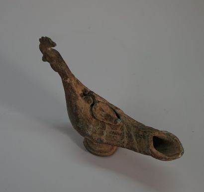 Large bronze oil lamp in the shape of a rooster.

Old...