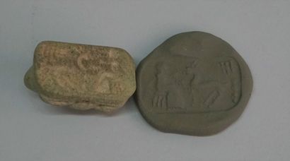 Small curved caprid in greenish brown stone....