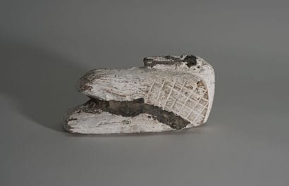 White lacquered wood statuette in the shape...