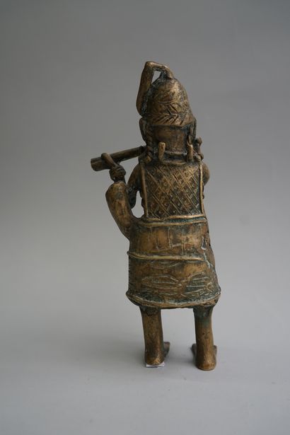 Figure presenting a flute player. Bronze...