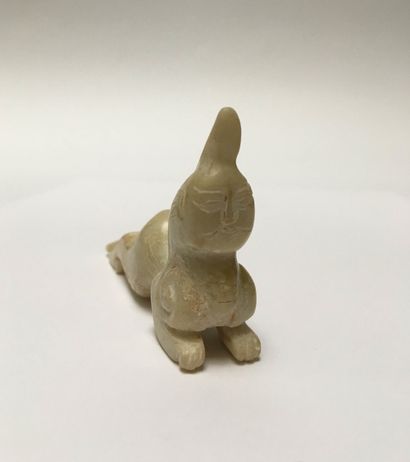 Mythical animal in beige jade. Body of a...