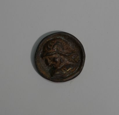 Small bronze token with brown and oxidized...