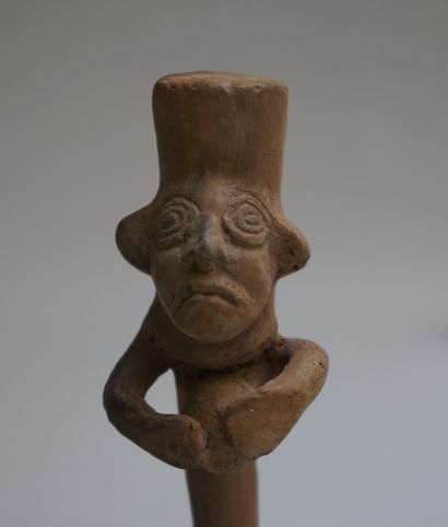 Whistle with a busted figure holding a ball....