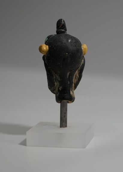 Head in black and polychrome glass paste,...