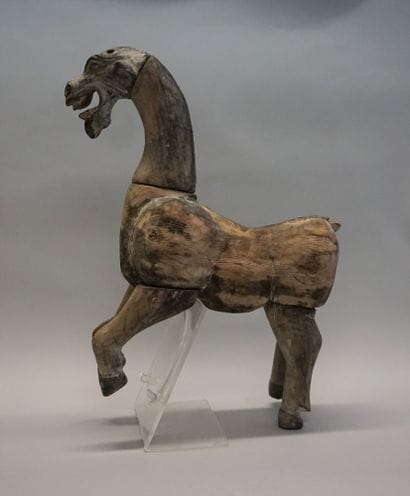 Horse shown prancing in natural wood. Han...