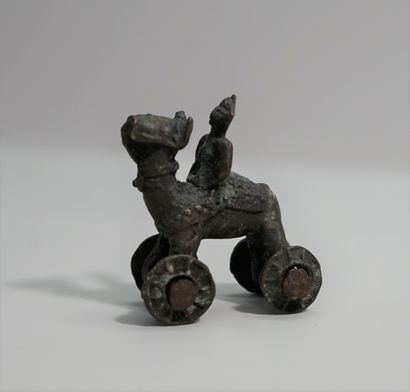 Set in bronze or patinated metal composed...