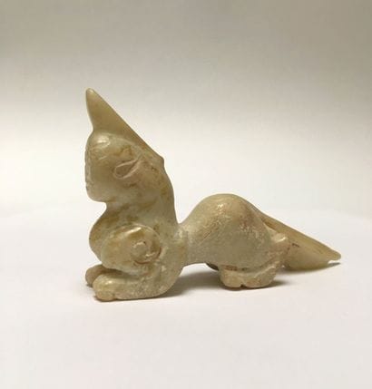 Mythical animal in beige jade. Body of a...