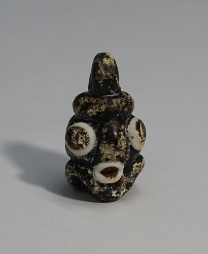 Small Phoenician style head in polychrome...