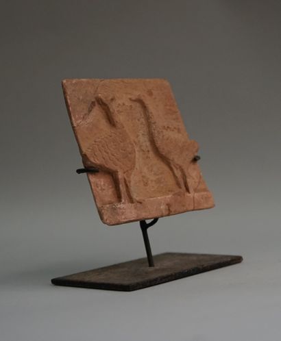 Terracotta plaque representing two geese...