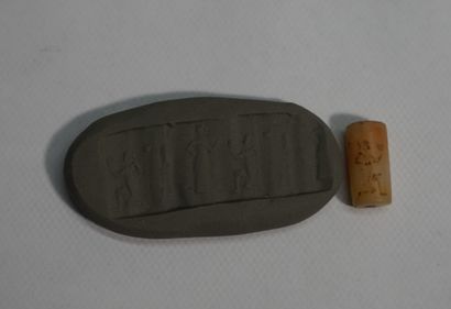 Small beige stone cylinder seal showing an...