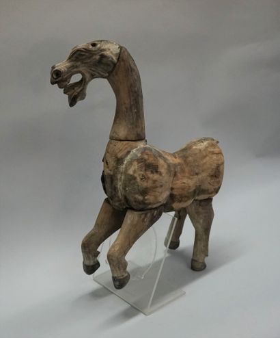 Horse shown prancing in natural wood. Han...