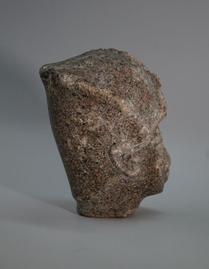 Stone head representing a pharaoh.

Ancient...