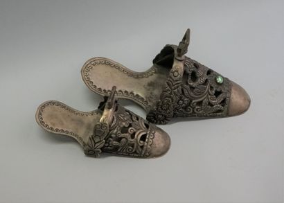 Two old ornaments in the shape of shoes,...