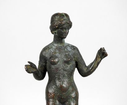 Very large statuette representing Venus holding...