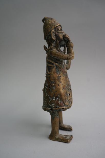 Figure presenting a flute player. Bronze...