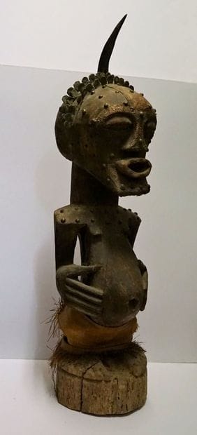 Large guardian fetish presenting a figure...