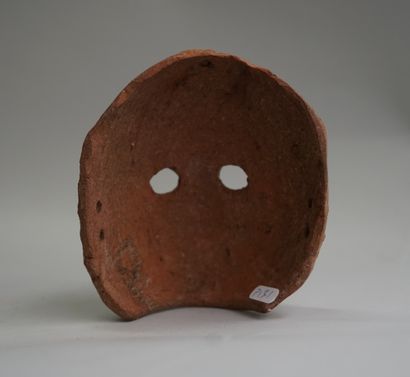 Diminutive mask in pink clay. Greco-Roman...