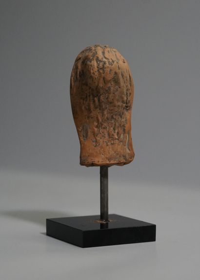 Terracotta head with earthy patina presenting...