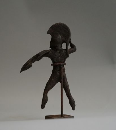 Oplite in bronze with green patina. Greek...