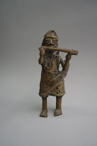 Figure presenting a flute player. Bronze...