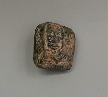 Idol in basalt stone with patina, representing...