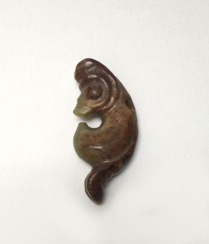 Small coiled dragon in green nephrite, veined...