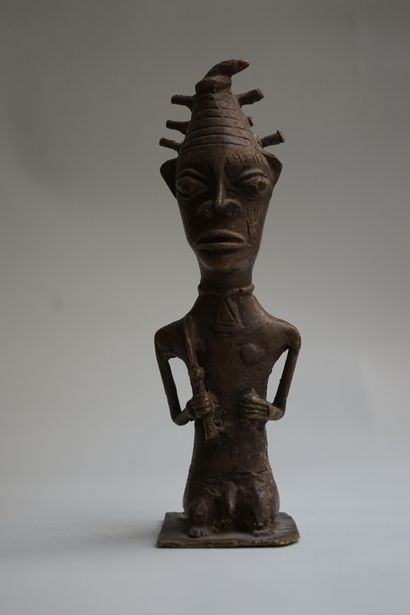 Anthropomorphic statuette of a sorcerer holding...