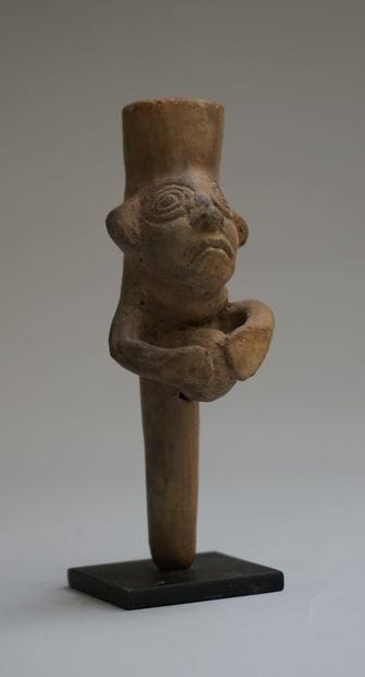 Whistle with a busted figure holding a ball....