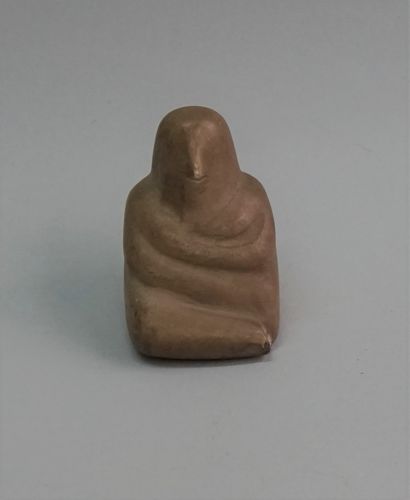 Small stone idol, seated man in late Neolithic...