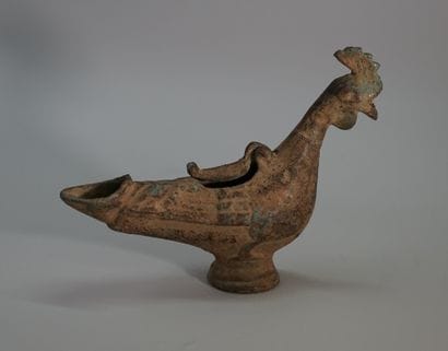 Large bronze oil lamp in the shape of a rooster.

Old...