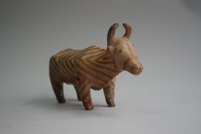 Orange and beige terracotta ox with herringbone...