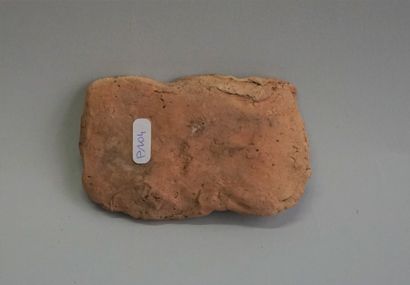 Terracotta plate decorated with slaves and...