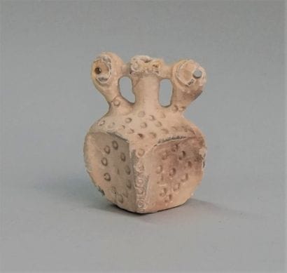 Square idol in soft stone with white slip....