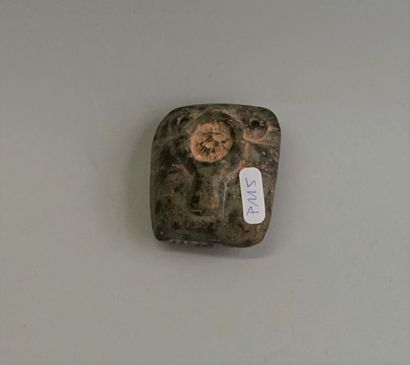 Idol in basalt stone with patina, representing...